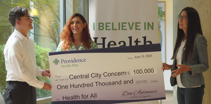 Central City Concern accepts donation check