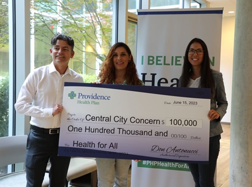 Providence Health Plan presents a check to Central City Concern