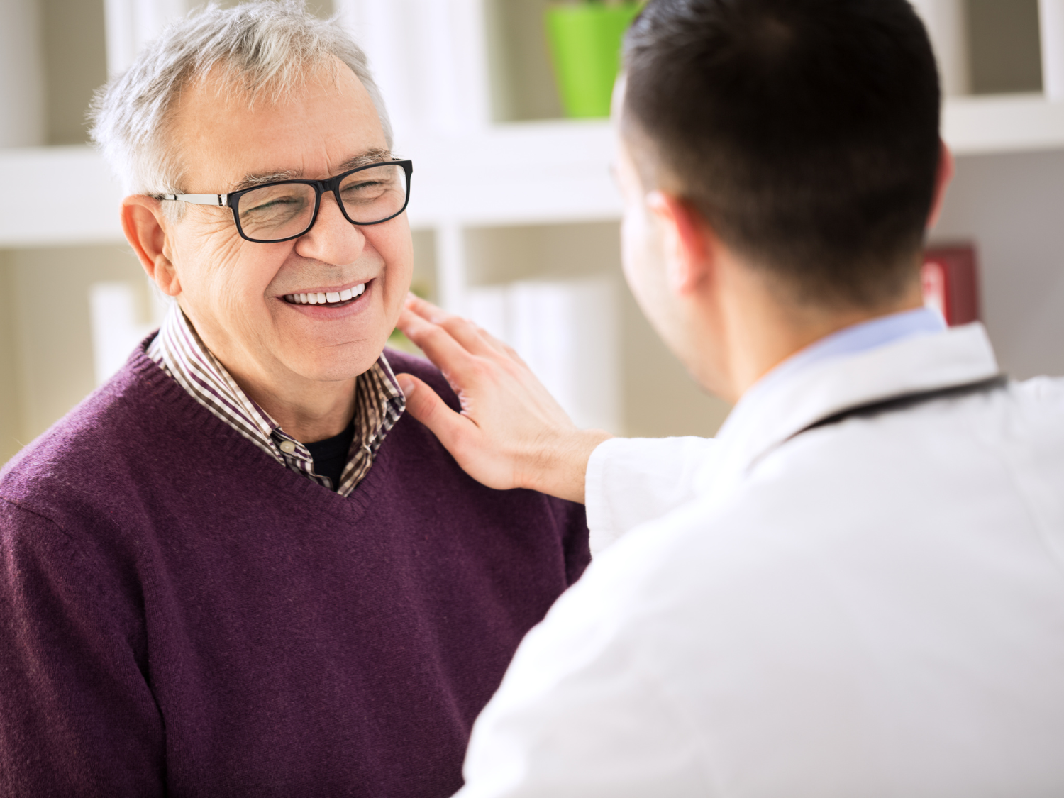 Male doctor treats patient
