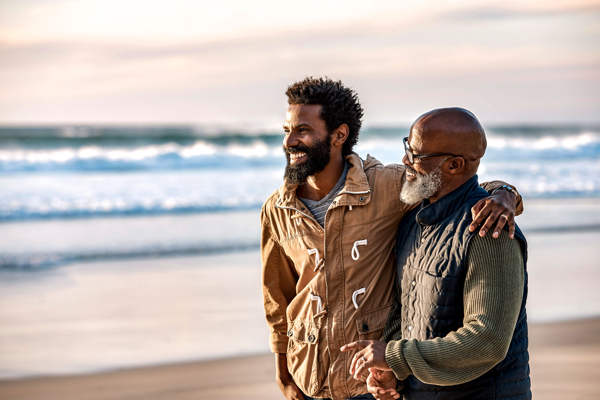 Father and son talking on the beach