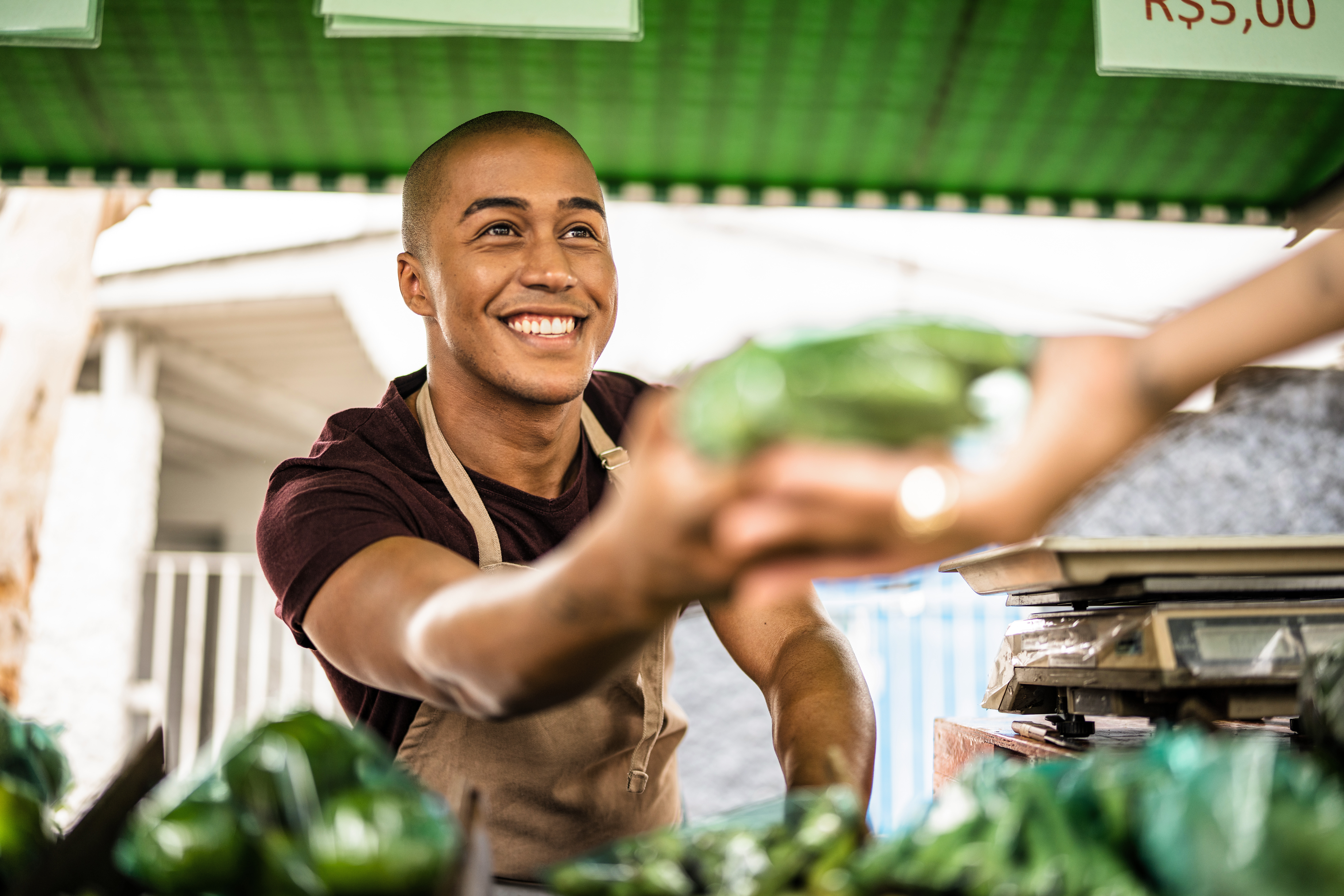 A smiling vendor