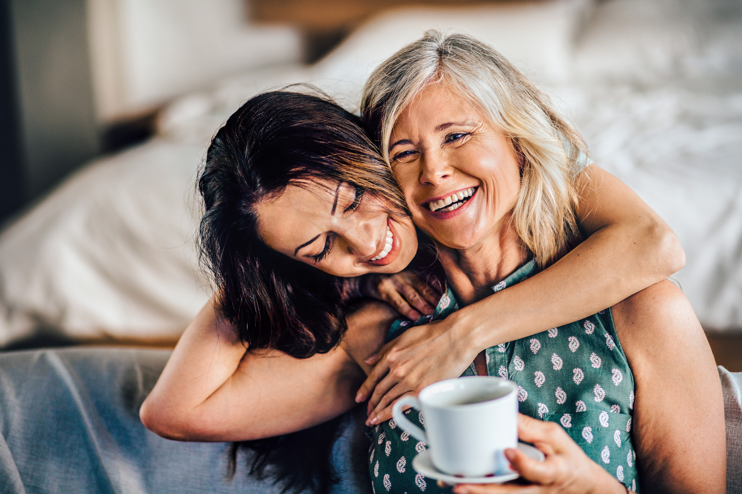 Mother and daughter hugging