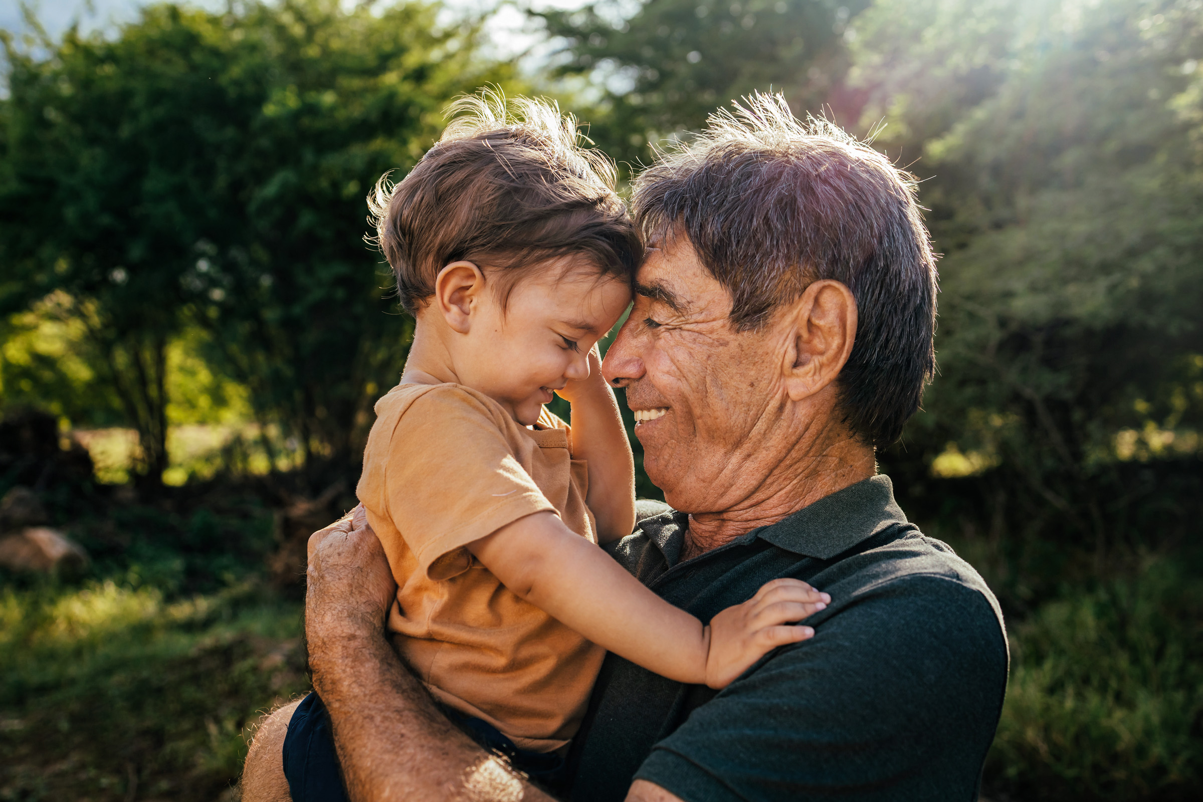 Boy snuggles with Papa